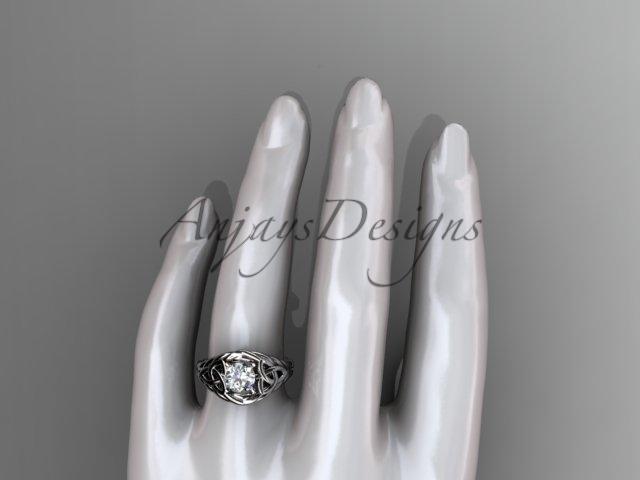 14kt white gold celtic trinity rope wedding ring with a "Forever One" Moissanite center stone RPCT964
