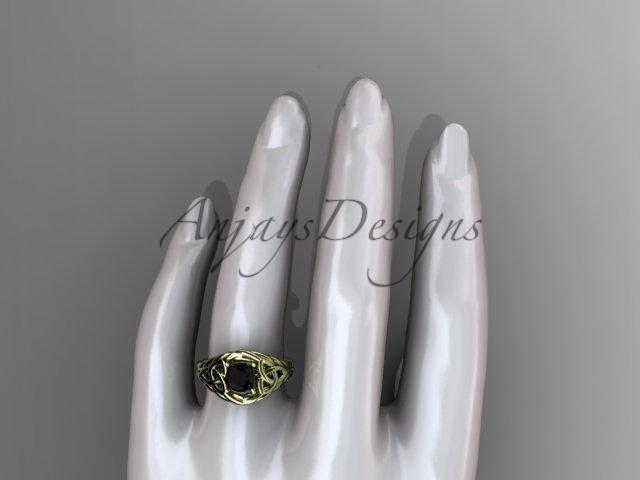 14kt yellow gold celtic trinity rope wedding ring with a Black Diamond center stone RPCT964